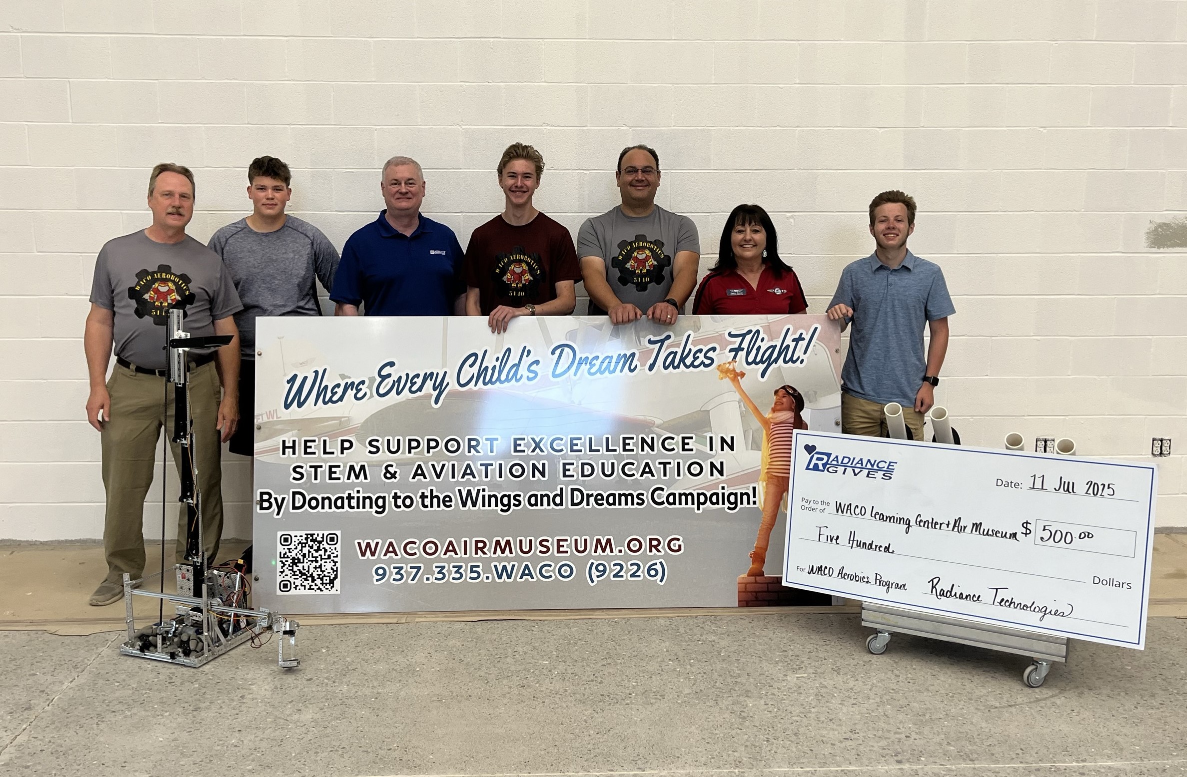 Radiance Gives check distribution to WACO Aerobotics
