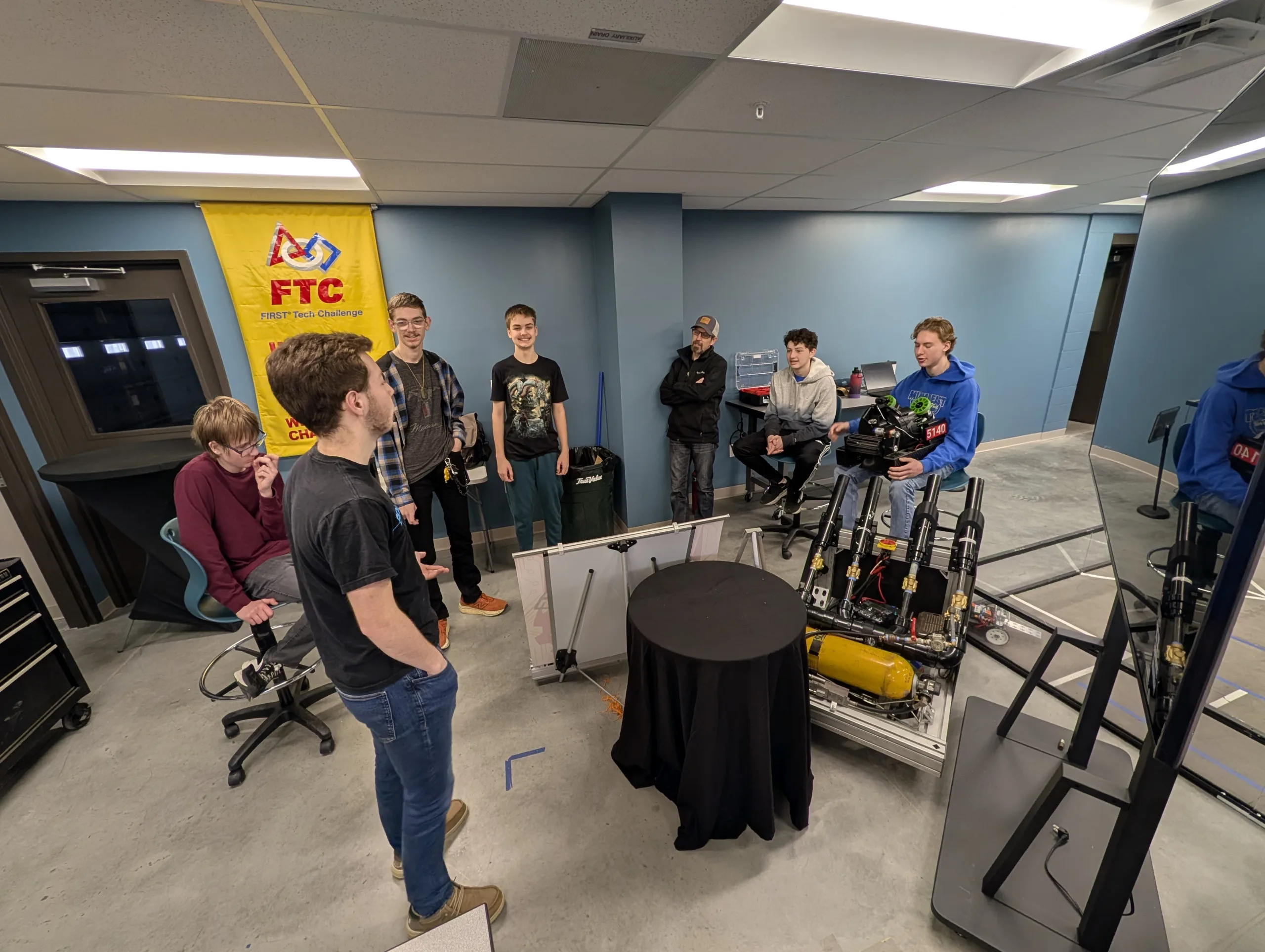 WACO Aerobotics Team meeting around table